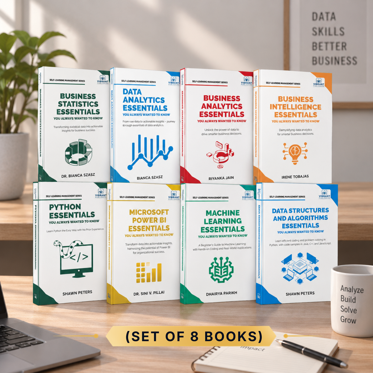 Eight business and tech books arranged in a 2x4 grid on a desk, with a laptop, notebook, and pen nearby. The books include titles such as Business Statistics Essentials, Data Analytics Essentials, Business Analytics Essentials, Business Intelligence Essentials, Python Essentials, Microsoft Power BI Essentials, Machine Learning Essentials, and Data Structures and Algorithms Essentials.