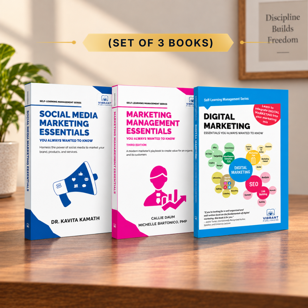 Three paperback books in a set displayed on a wooden surface with a blurred indoor background. The books are titled 'Social Media Marketing Essentials', 'Marketing Management Essentials', and 'Digital Marketing', with colorful covers in white, pink, and blue.