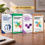 Four paperback books from Jaquina Gilbert's Self Learning Management Series are lined up on a wooden desk. The books have distinct colored covers: blue, green, purple, and brown, with white titles.