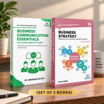 Two books from the Vibrant Publishers Self-Learning Management Series displayed on a wooden desk: 'Business Communication Essentials' with a green and white cover, and 'Business Strategy Essentials' with a pink and white cover. 