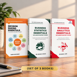 Three business books standing upright on a wooden surface: 'Decision Making Essentials' by Mark Koscinski, 'Business Statistics Essentials' by Dr. Bianca Szasz, and 'Business Analytics Essentials' by Riyanke Jain.