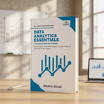 A paperback book titled 'Data Analytics Essentials' by Bianca Szasz stands open on a wooden desk in a bright, modern office setting.